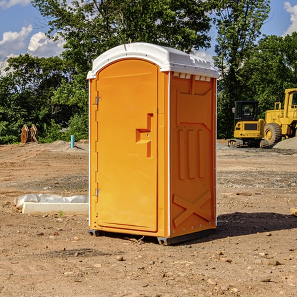 what is the cost difference between standard and deluxe portable restroom rentals in Jerry City